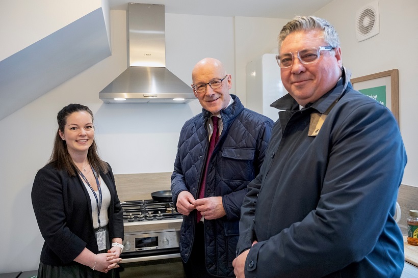 Lorna and Simon from SGN in the hydrogen demonstration home kitchen with Scotland First Minster John Swinney