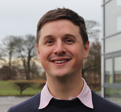 Headshot of a smiling person