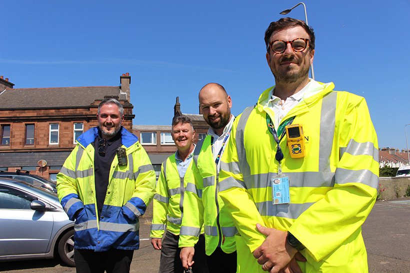 A group of engineers wearing hi-vis clothing