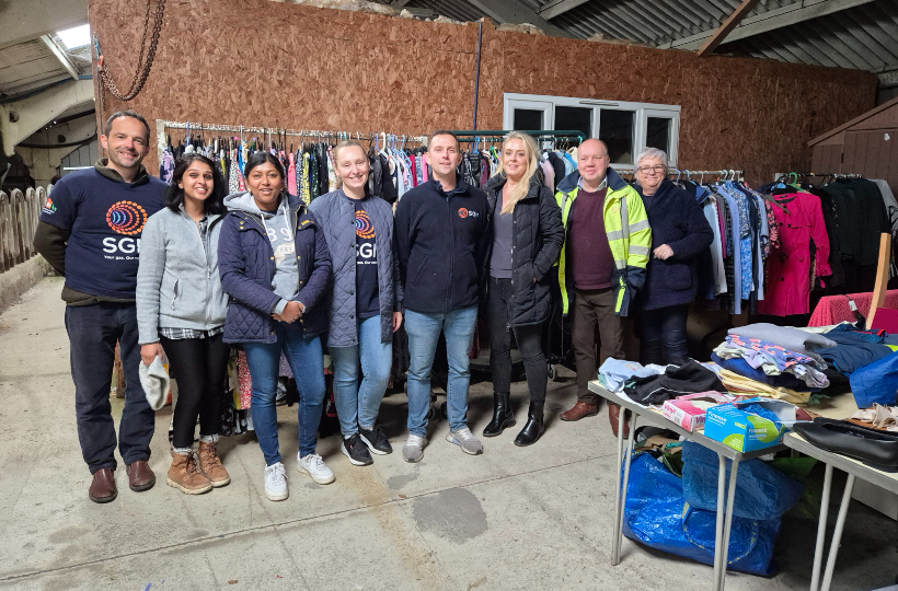 Colleagues from our Legal Services team standing in a line for a picture at the Orpheus centre in Godstone