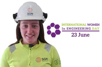 A smiling women in SGN PPE on a white background next to the logo for International Women in Engineering Day